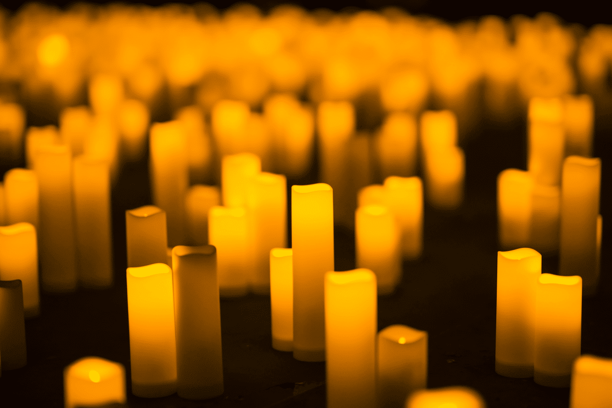 A close up of candles on display on the floor.