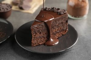 Chocolate cake gets sauce drizzled on top